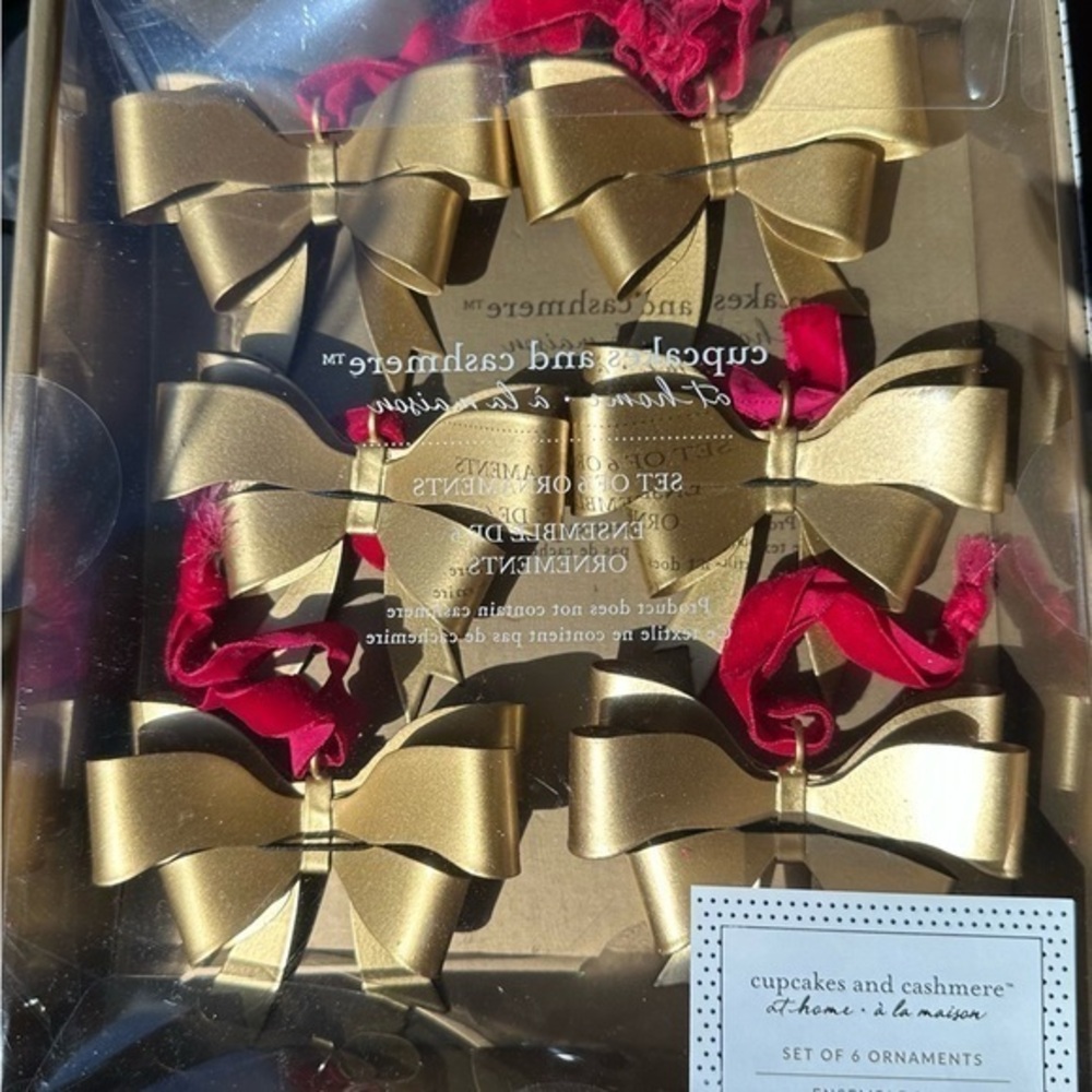 Cupcake and Cashmere gold medal bow ornaments with red velvet ribbon